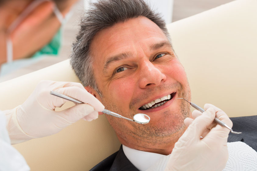 Dentist Performing Root Canal Treatment in Quincy and Norwell, MA