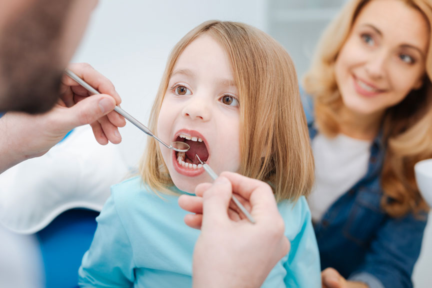 "Kid Getting her Teeth Treated at a Children's Dentistry Service in Quincy and Norwell, MA " Dentist in Quincy and Norwell