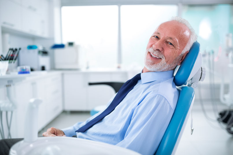 An Older Man Sitting in a Dental Chair