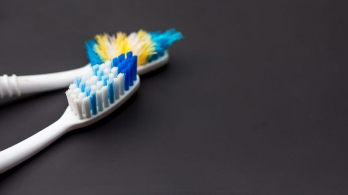 Old & New Toothbrushes With White & Blue Bristles