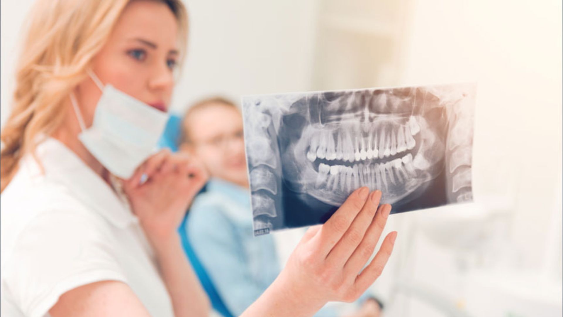 Dentist Showcasing A Dental X-ray